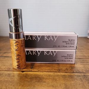 Two Mary Kay Shimmering Gold Lip Gloss.